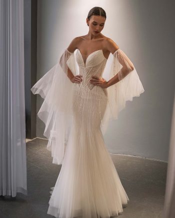 fit and flare wedding dress with cape sleeves, shimmer layer and beading, photographed at Papilio Boutique Toronto, bridal stores in Toronto