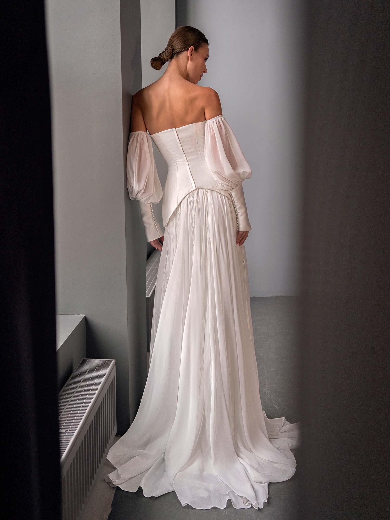 back view of two piece wedding dress with corset top and beaded skirt by Papilio Boutique in Toronto, shown with detachable puff sleeves