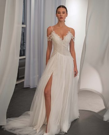 off the shoulder tulle wedding dress with lace bodice and slit by Papilio Boutique bridal store in Toronto