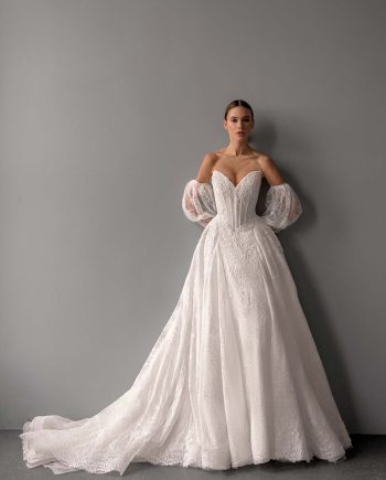 Shimmering lace ballgown wedding dress with detachable sleeves by Papilio, lace train and basque waist — photographed for Papilio Boutique bridal shop Toronto.