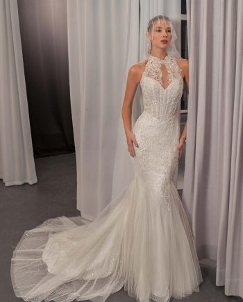 Shimmering halter neck mermaid wedding dress with beaded lace and basque waist by Papilio Boutique bridal store in Toronto.