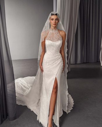 Lace fit and flare halter neck wedding dress with open back and train, by Papilio Boutique bridal store in Toronto.