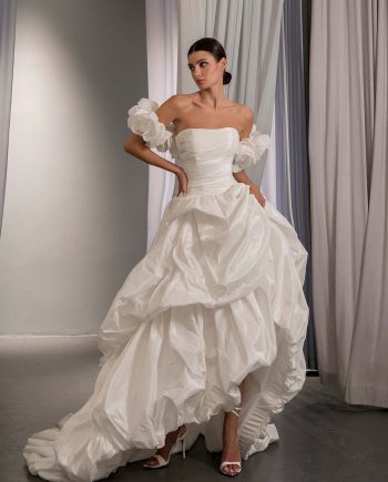 High low wedding dress with off the shoulder 3D floral sleeves and layered bubble skirt, by Papilio Boutique, Toronto bridal store.