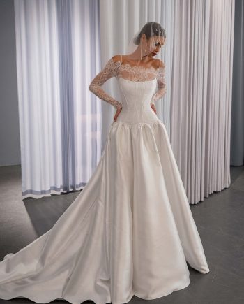 Drop waist ballgown wedding dress with mikado skirt and corset bodice, long sleeve lace bolero, dress by Papilio Boutique, Toronto bridal store.